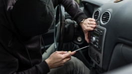 man-breaking-into-car