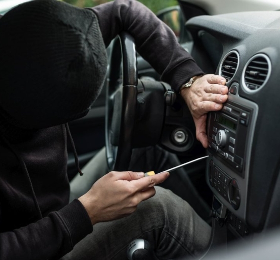 man-breaking-into-car